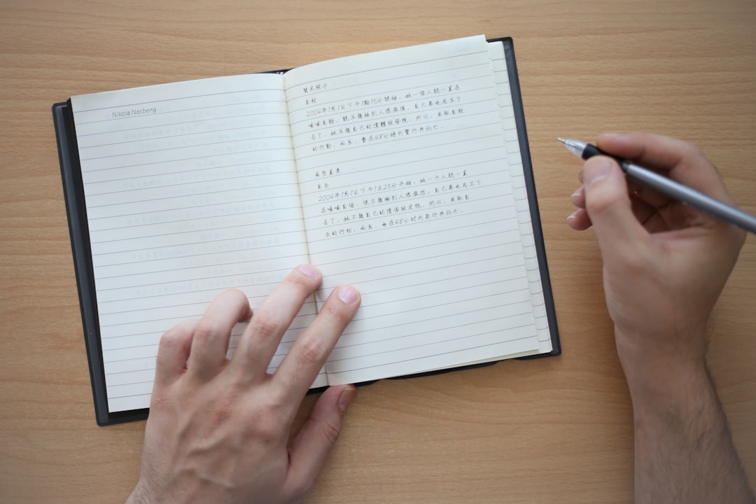 Person writing in gratitude journal with peaceful, joyful expression surrounded by soft morning light