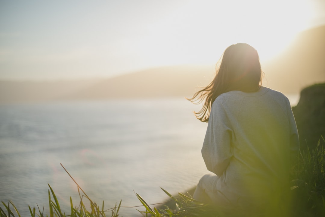 Person practicing visualization meditation with closed eyes and peaceful expression