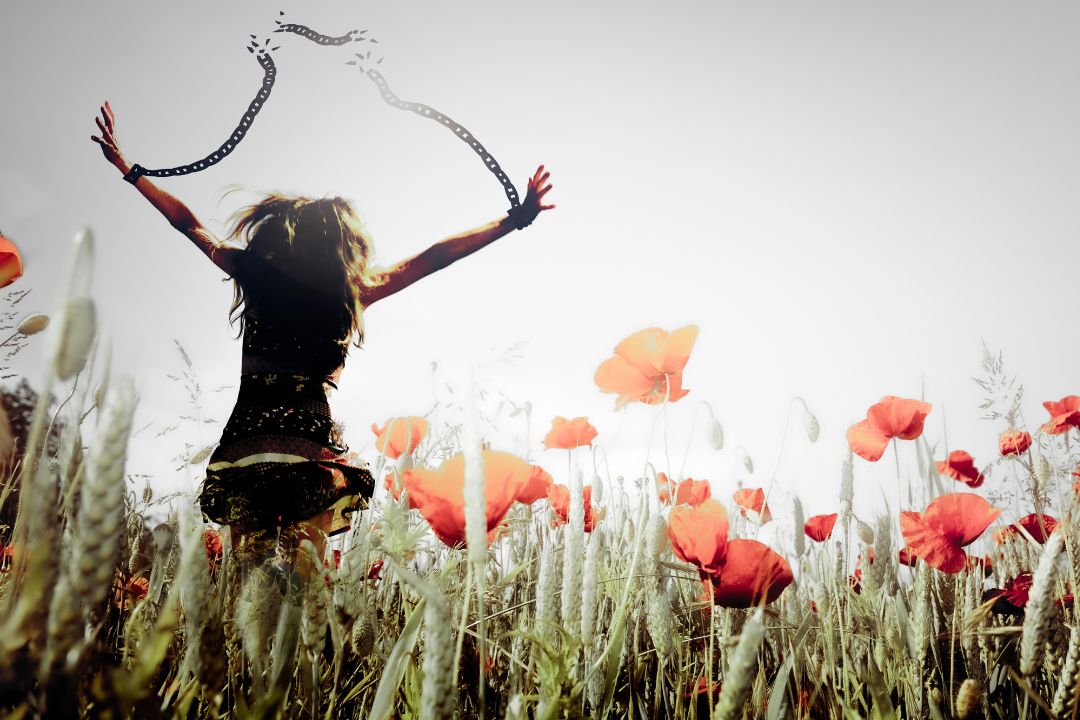 person breaking free from chains limiting beliefs spiritual transformation